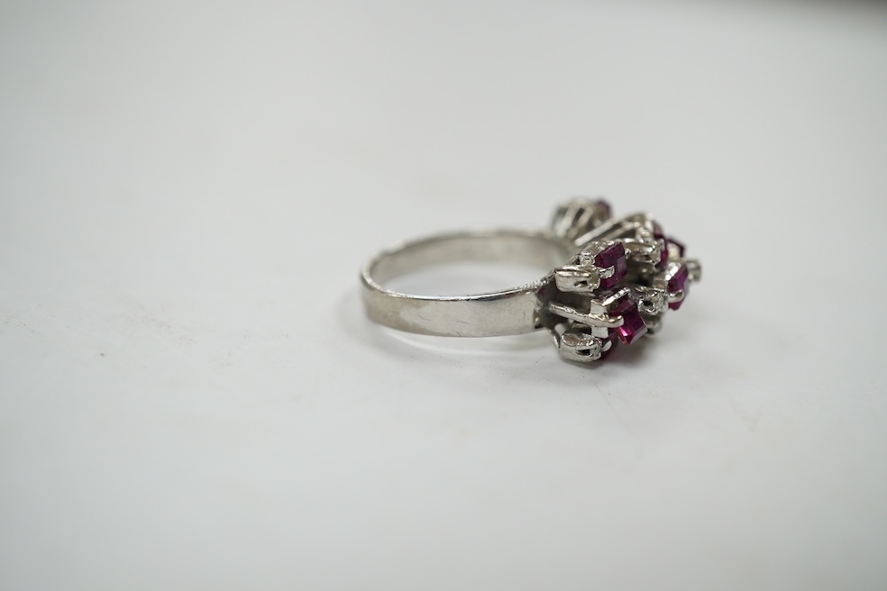 An 18k white metal, ruby and diamond cluster set cocktail ring, size K/L, gross weight 5.7 grams. Condition - fair to good